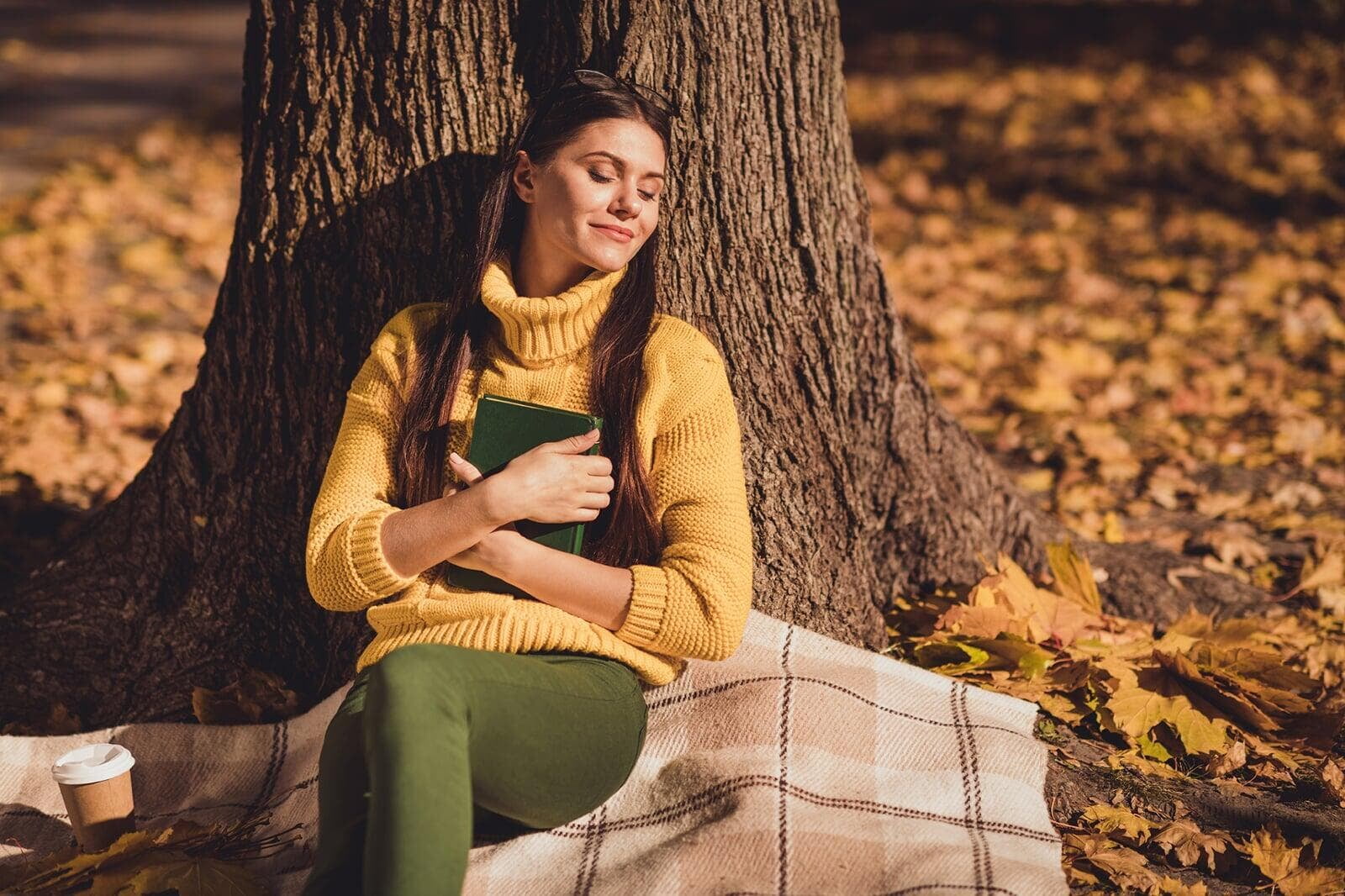 woman sitting in stillness in the woods